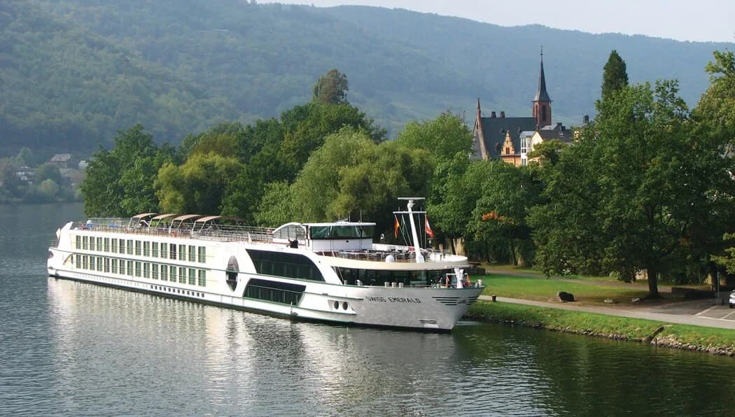 Tauck river cruise ship sailing past the town of Bernkastel