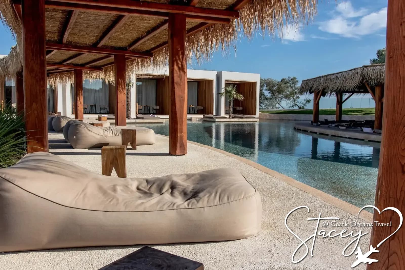 Palm-lined pool at a tropical all-inclusive resort