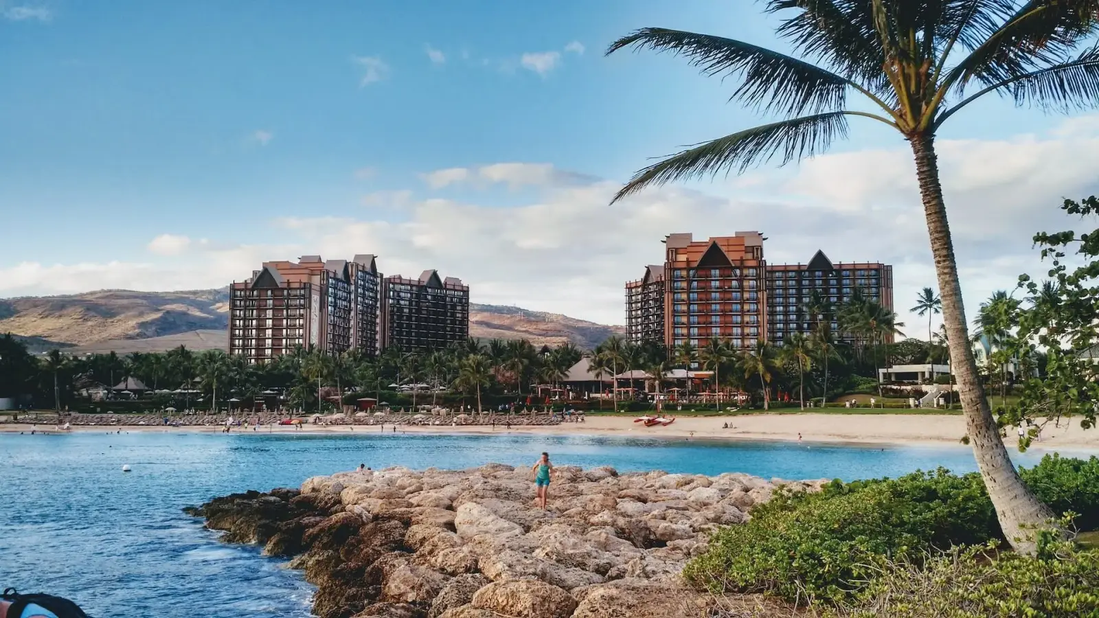 Aulani, a Disney Resort & Spa, towers above the beach and lagoon at Ko Olina, Hawaii