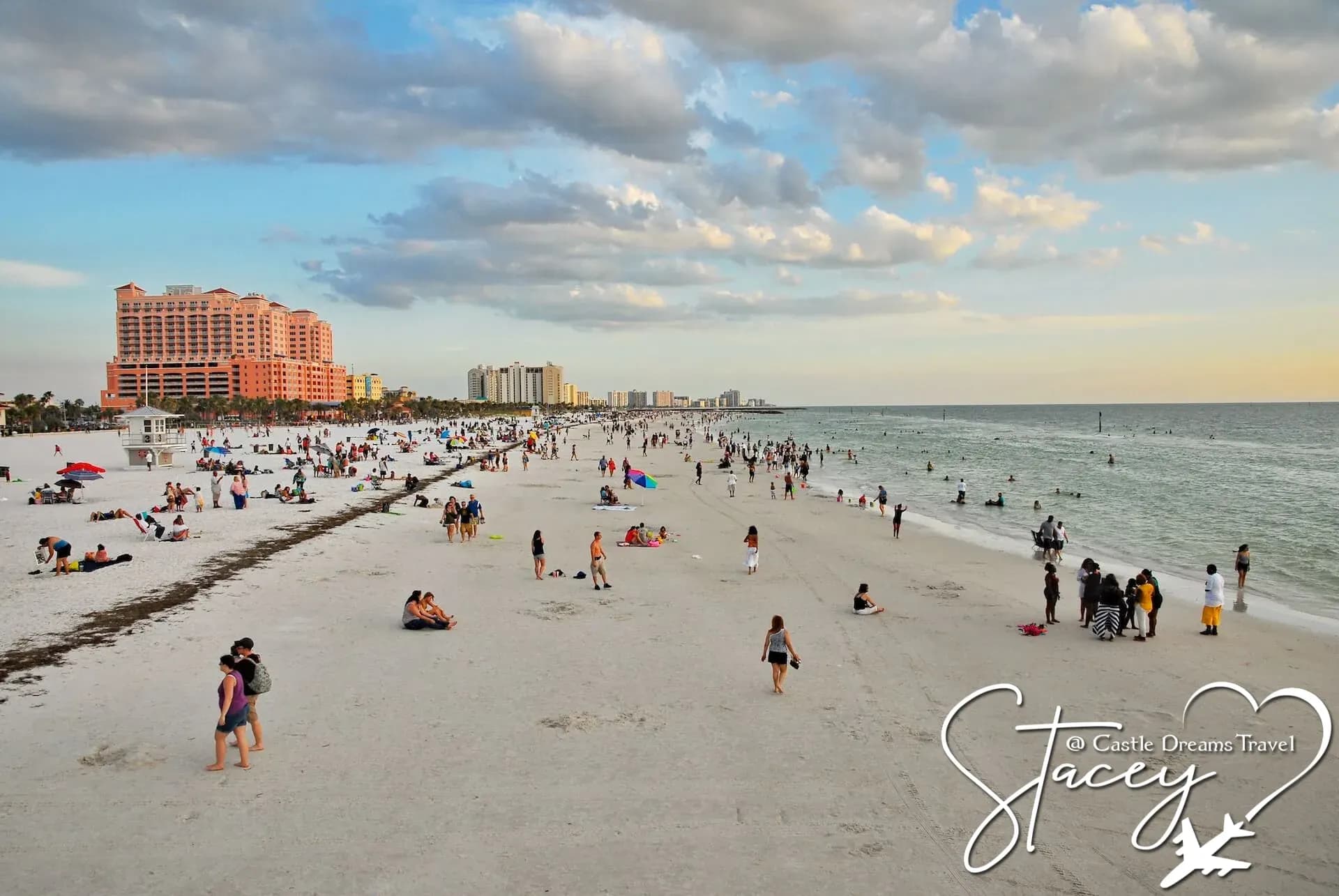 Crowds enjoying the wide white-sand shoreline of Clearwater Beach