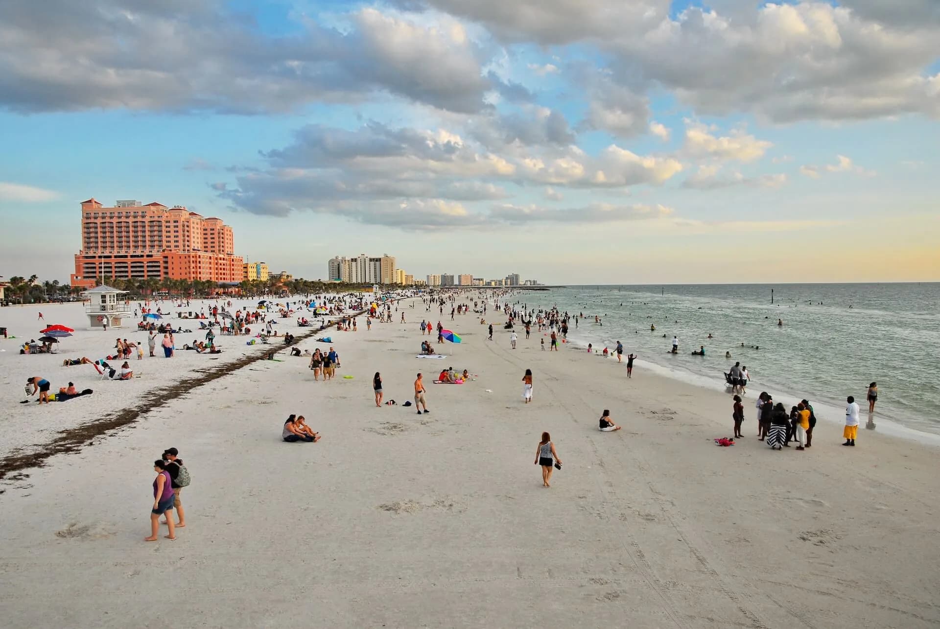 Crowds enjoying the wide white-sand shoreline of Clearwater Beach