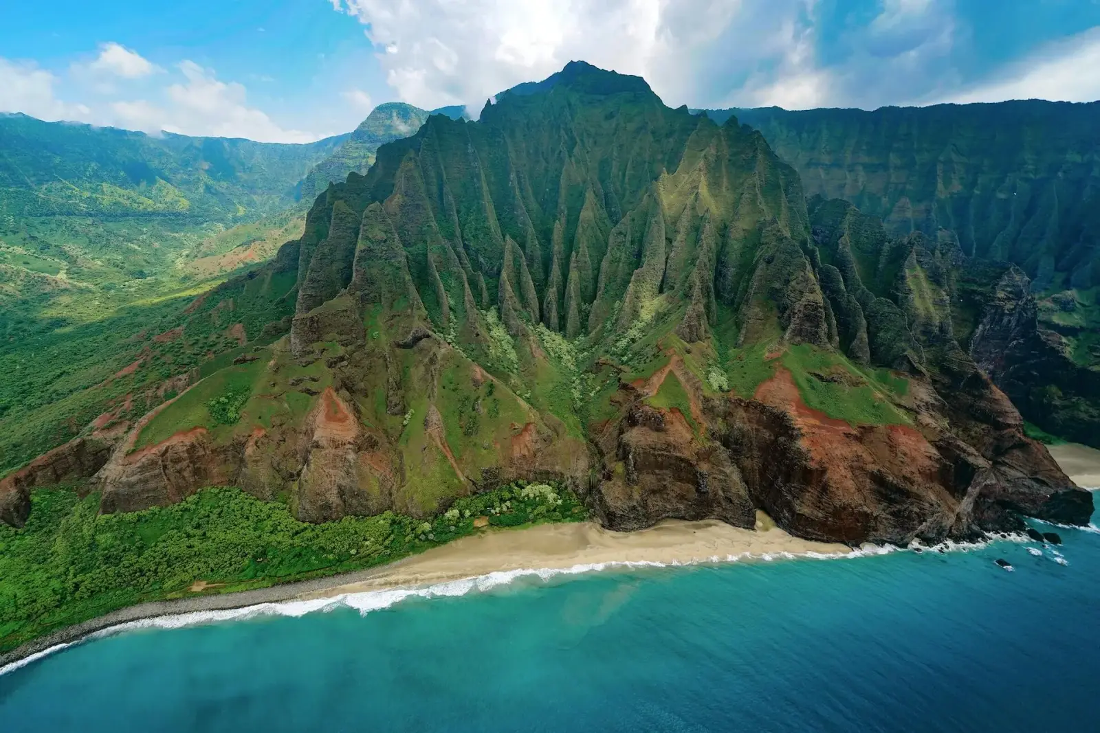 Hawaiian coastline with volcanic cliffs and Pacific surf
