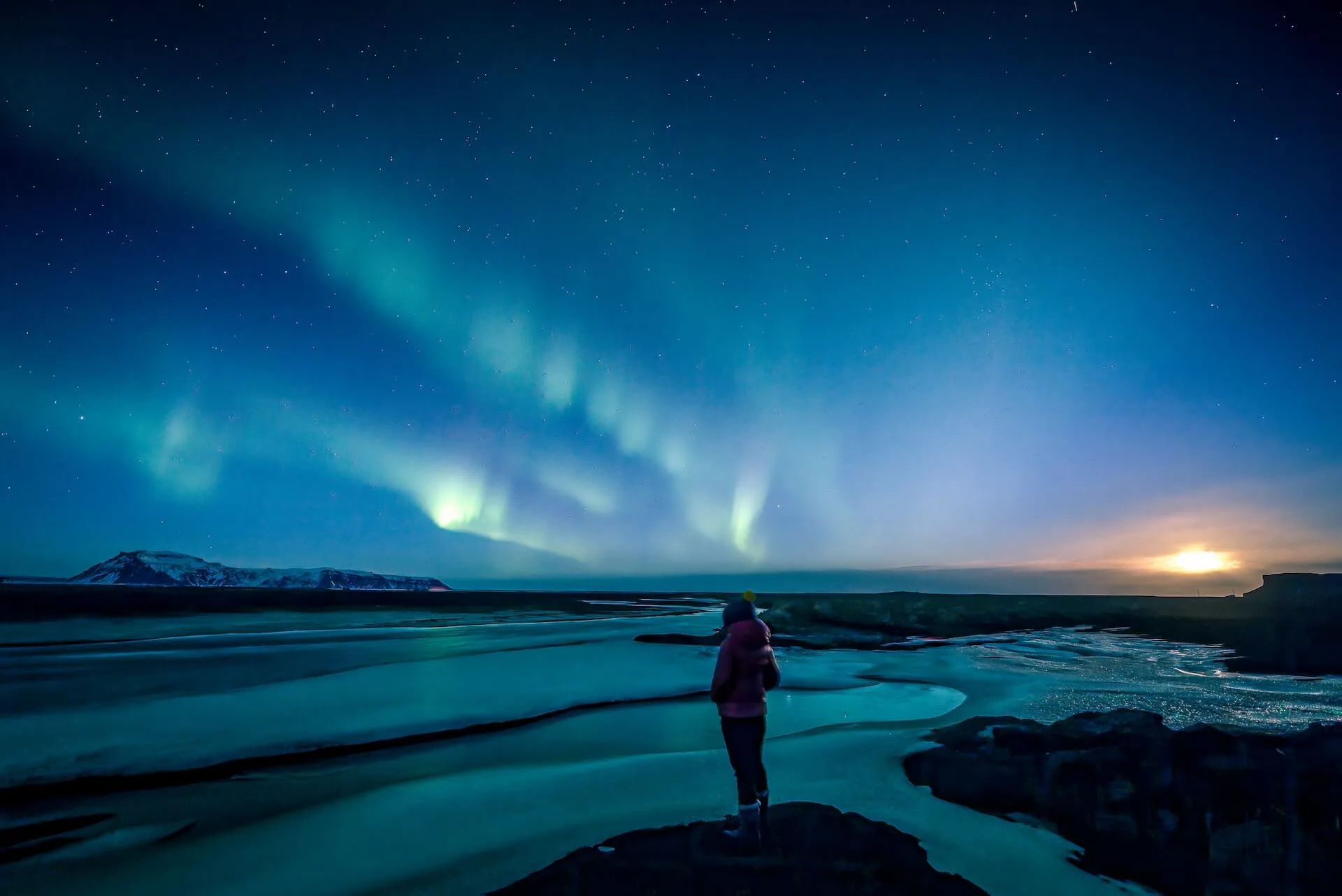 Green Aurora Borealis swirling over Iceland's night sky
