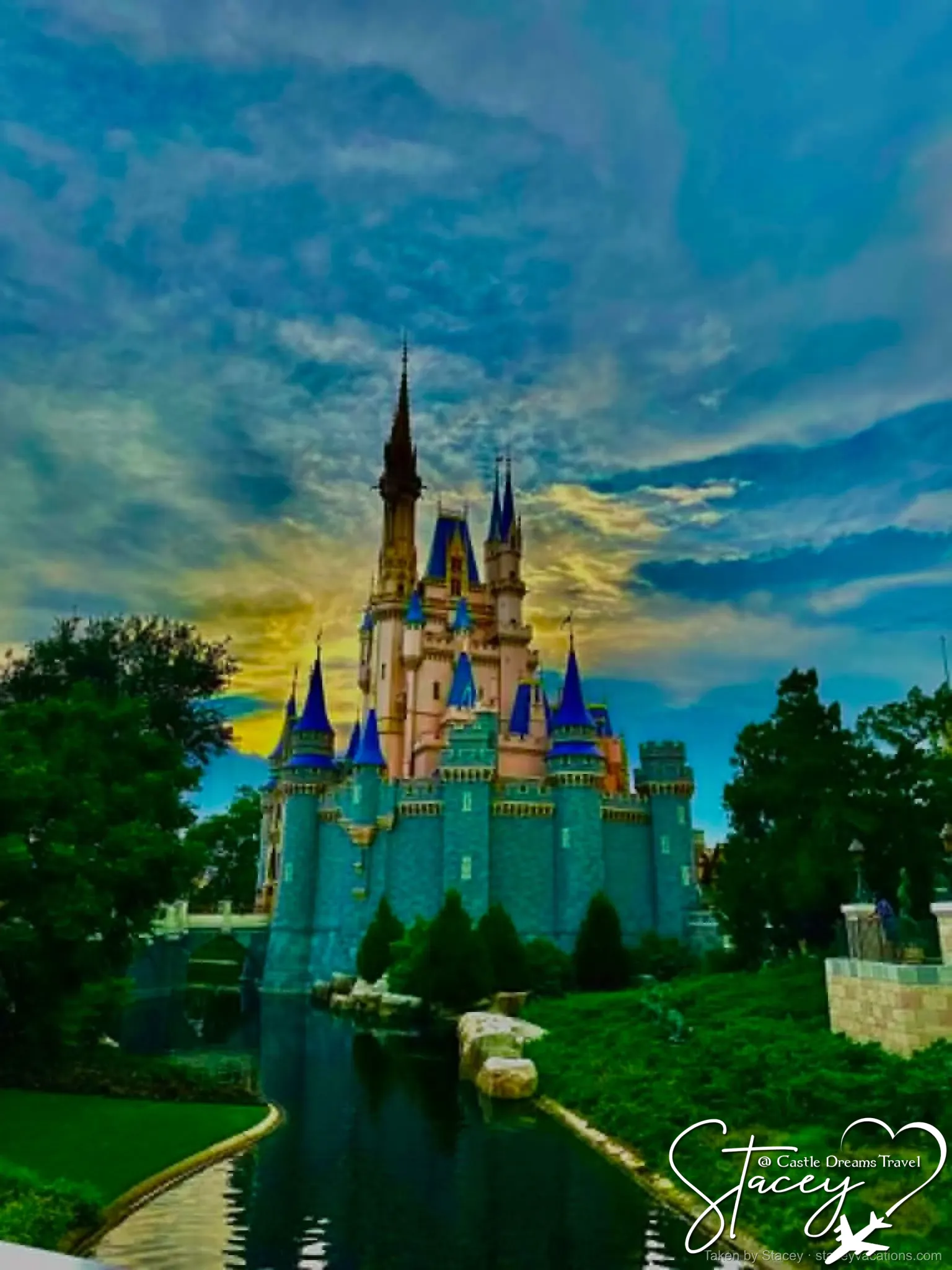 Cinderella Castle at sunset across the moat at Magic Kingdom — photo by Stacey