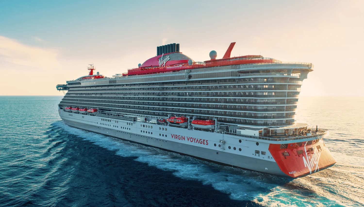 Virgin Voyages cruise ship at sea with its signature red-and-white livery